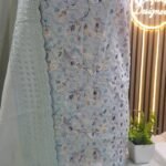 Unstitched pakistani indian alpine chikenkari embroidered winter suits .